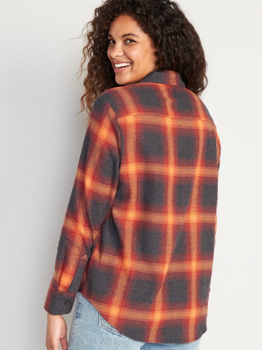 a model styled in the black and orange flannel