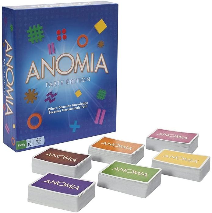 The game box for Anomia Party Edition placed beside six stacks of cards, each featuring a different colored back.