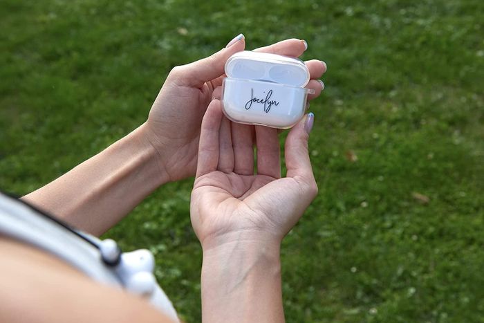 A person holding a case that has the name 'Jocelyn' on it
