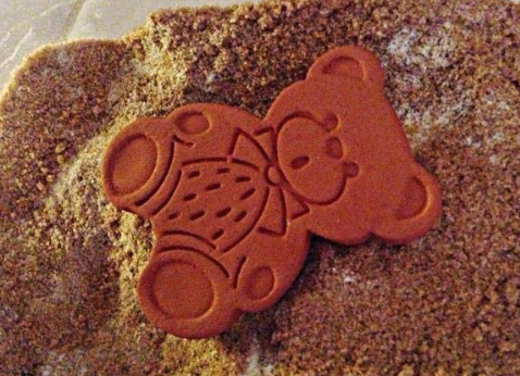 the bear nestled in a pile of sugar
