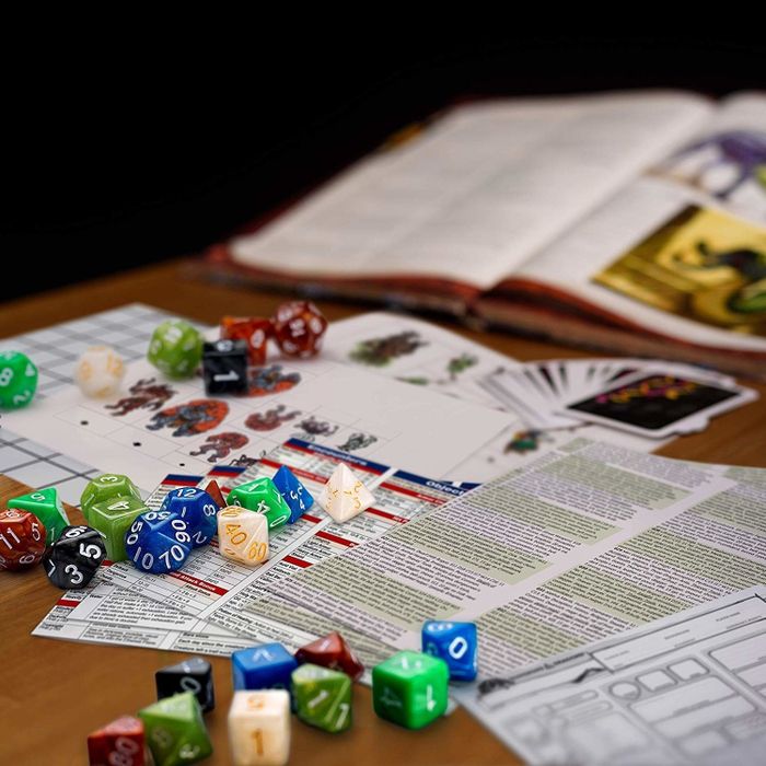 A set of D&D books and accompanying dice.