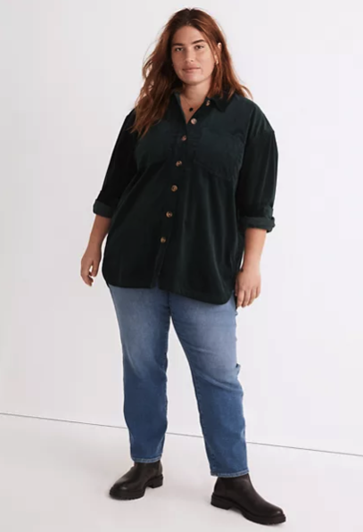 A model in a dark green corduroy shacket