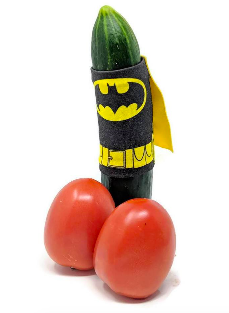 Cucumber dressed in a Batman-inspired wrap and cape, adding a playful twist