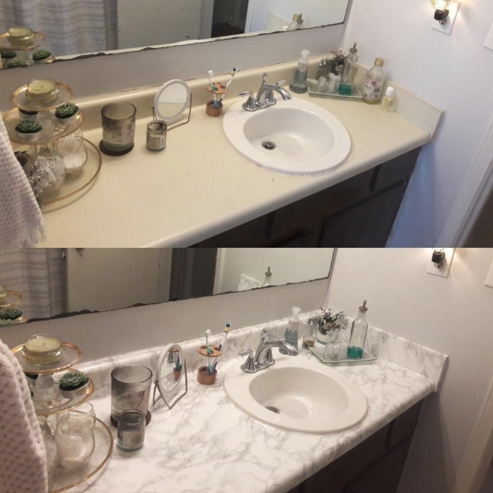 A bathroom counter—one section without the film and another with it applied