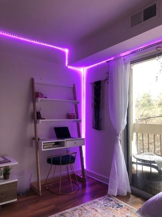 A reviewer using the purple LED string to decorate a corner of their room.