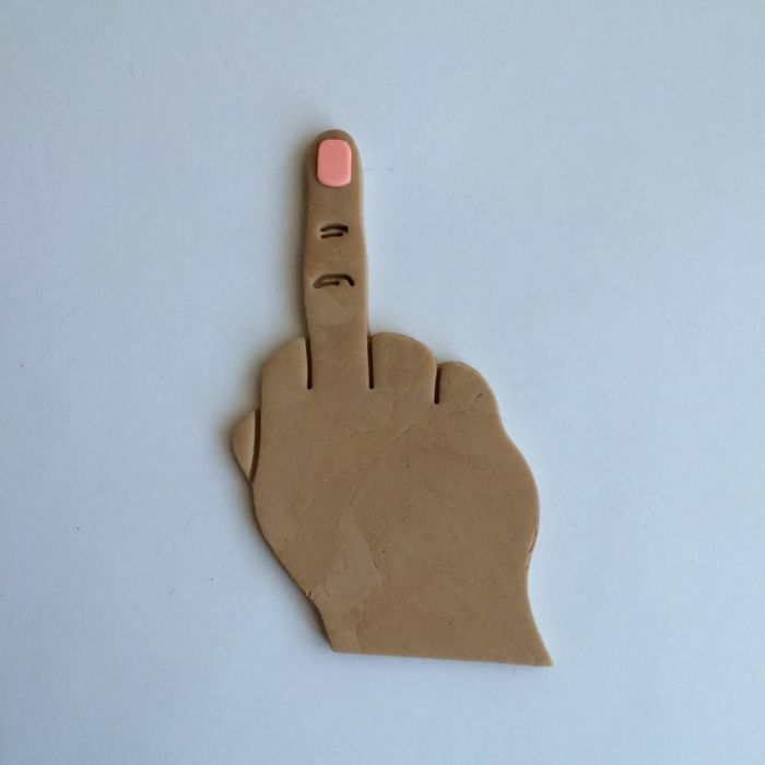 Cookie dough shaped like a hand flipping the bird