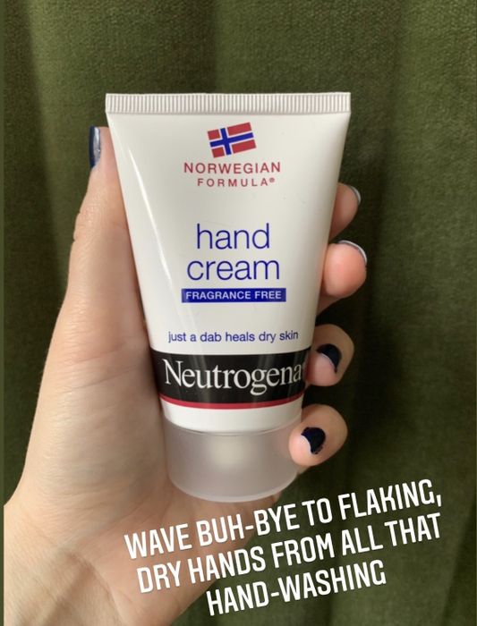 A hand holds a small tube of cream with the message,