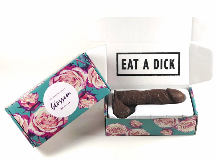 Packaging containing a large milk chocolate penis with the phrase 