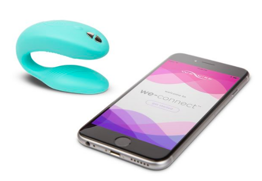 U-shaped vibrator placed next to a smartphone displaying the control app