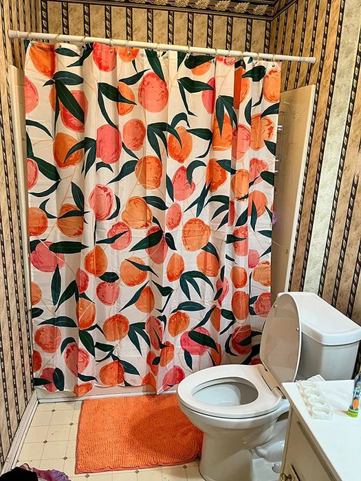 The shower curtain installed in a bathroom