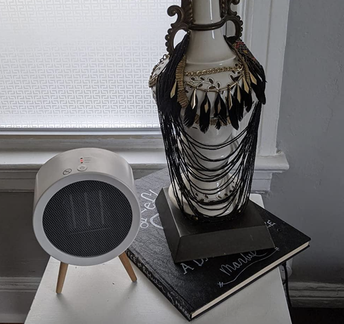 A photo of the space heater on a nightstand.
