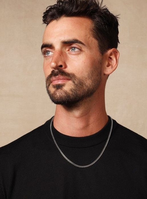 A model showcasing a stainless steel chain necklace