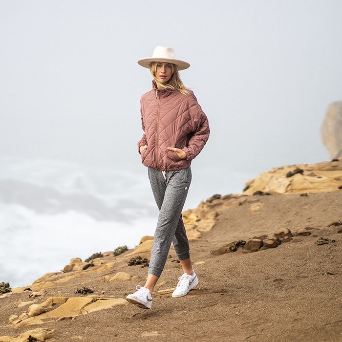 Person wearing warm-weather performance joggers while hiking.