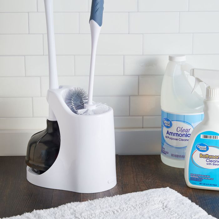 a bowl brush and plunger neatly stored inside the holder