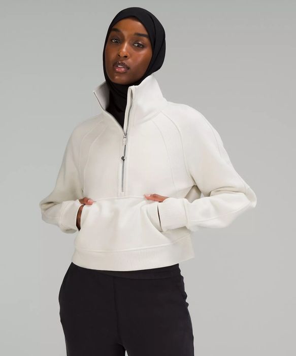 A photo of a model in a white sweatshirt