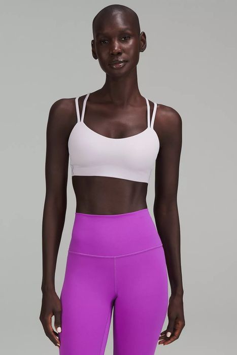 A photo of a model in a pink bra