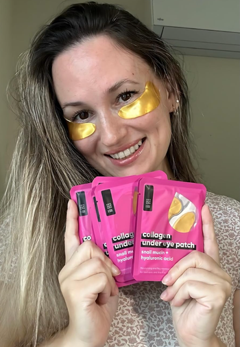 model smiling, sporting golden under-eye patches
