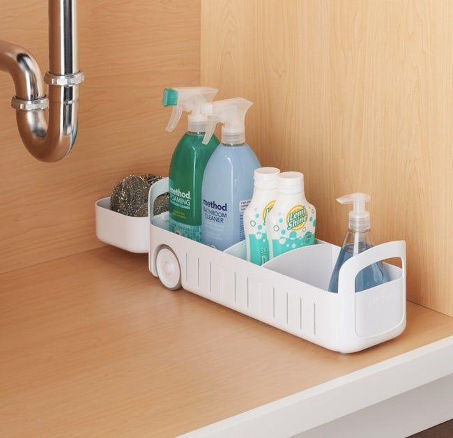the white caddy neatly organizing cleaning supplies and toiletries