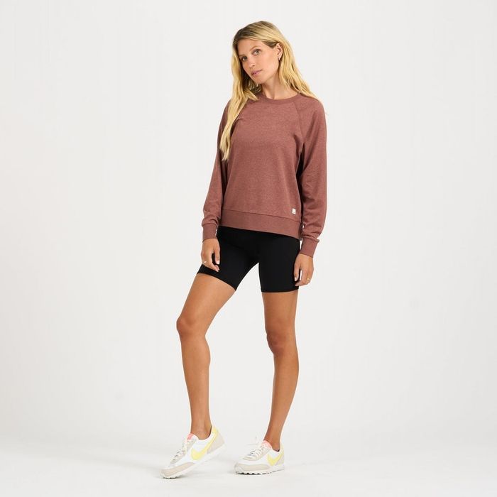 Model showcasing a pink long-sleeved Halo Crew sweater.