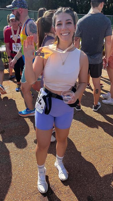 a reviewer wearing purple bike shorts