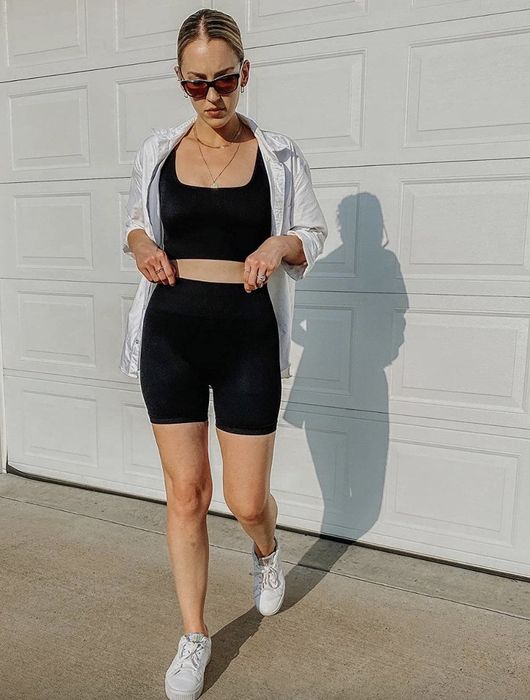 a reviewer wearing the black version of the set