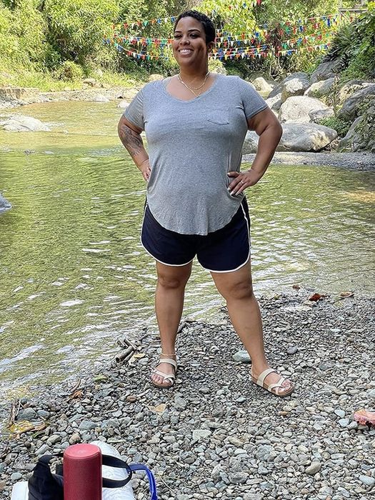 a reviewer in black shorts paired with a grey top