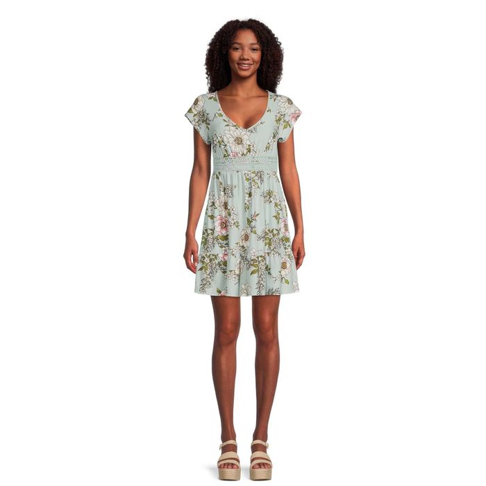 Model wearing a blue-green floral baby doll dress.