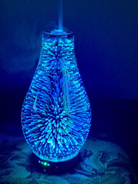 Reviewer photo showing the diffuser glowing in the dark