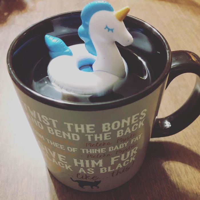 The tea infuser floating in a mug, adding a fun twist to the tea brewing process.
