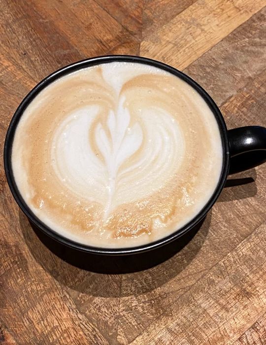 A beautifully crafted latte made from espresso brewed in the moka pot, perfect for enjoying a cafe-quality drink at home.