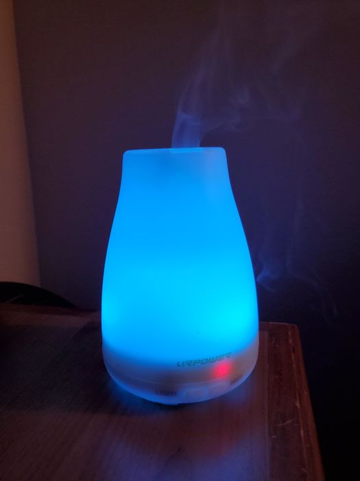 A reviewer’s photo of the diffuser glowing in a soothing blue hue