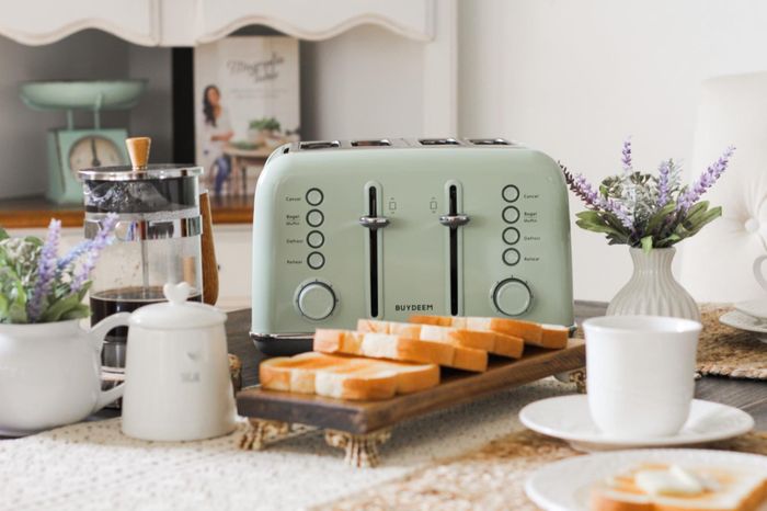 A reviewer's picture showcasing the four-slice toaster in a soothing green shade
