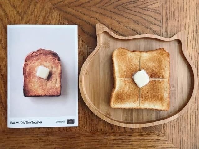 a slice of perfectly golden brown toast with butter spread on top