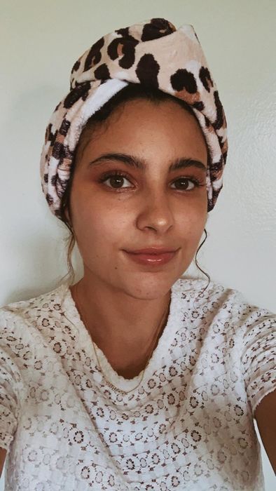 A reviewer wearing the Kitsch microfiber hair towel.