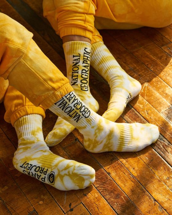 two people in sweatpants rocking tie-dyed socks