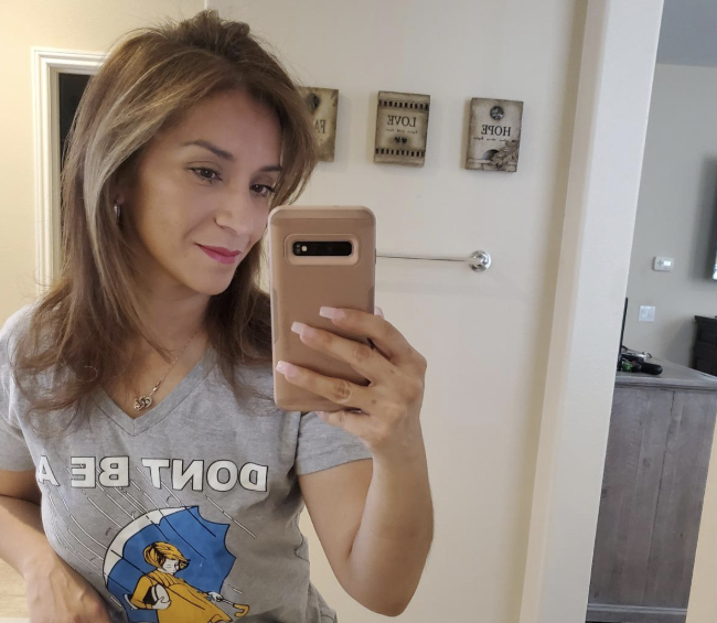 The reviewer's after shot showing dry, sleek, styled hair.