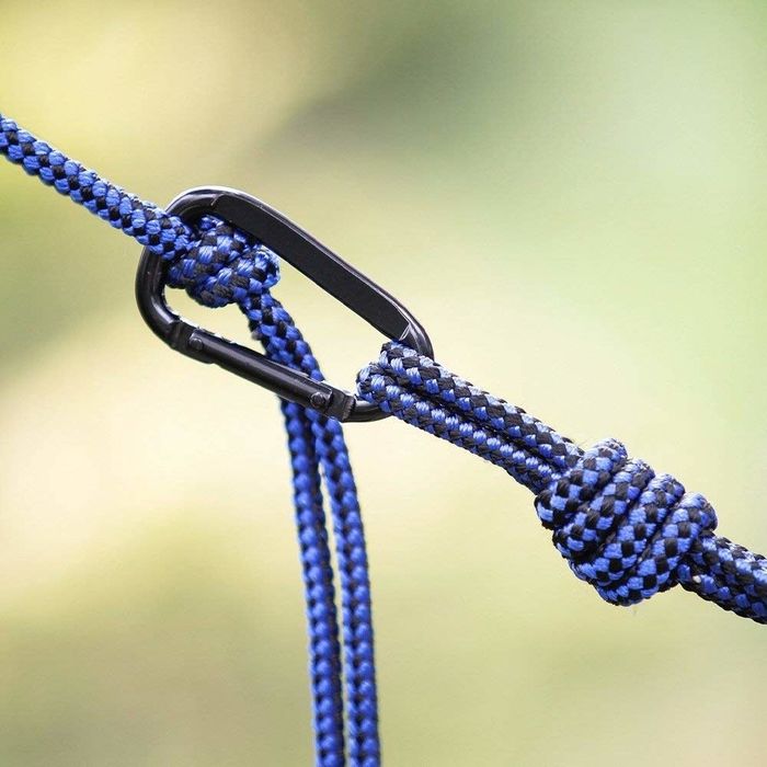 A close-up view of the carabiner and rope used to secure the hammock.