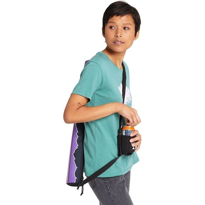 A model wearing the vertical insulated cooler with a coozie attached to the strap
