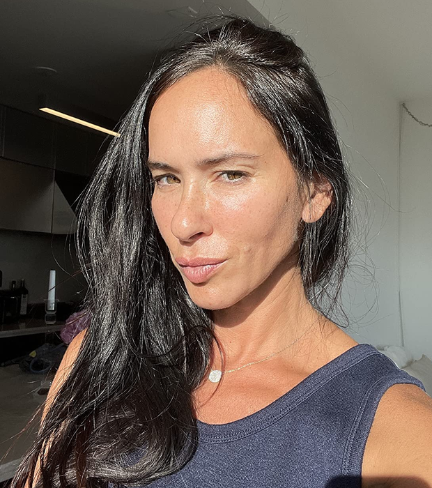 A reviewer with healthy, shiny dark straight hair.