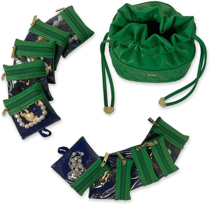 The green purse, complete with ten pouches, each containing a piece of jewelry.