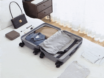 A gif showing items being efficiently packed into the suitcase.