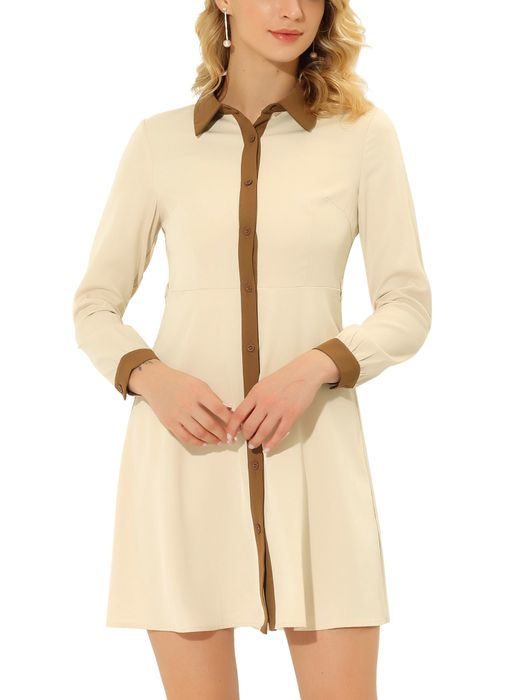 A model showcasing the beige and tan long-sleeve dress