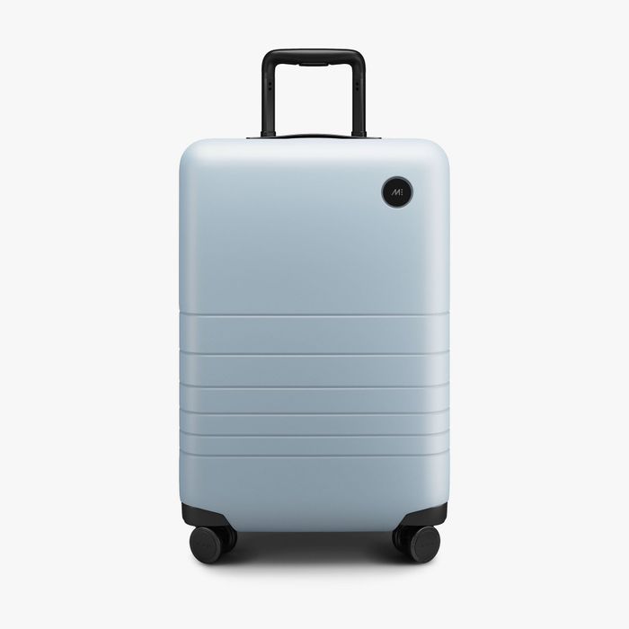 The carry-on suitcase in a vibrant shade of blue.