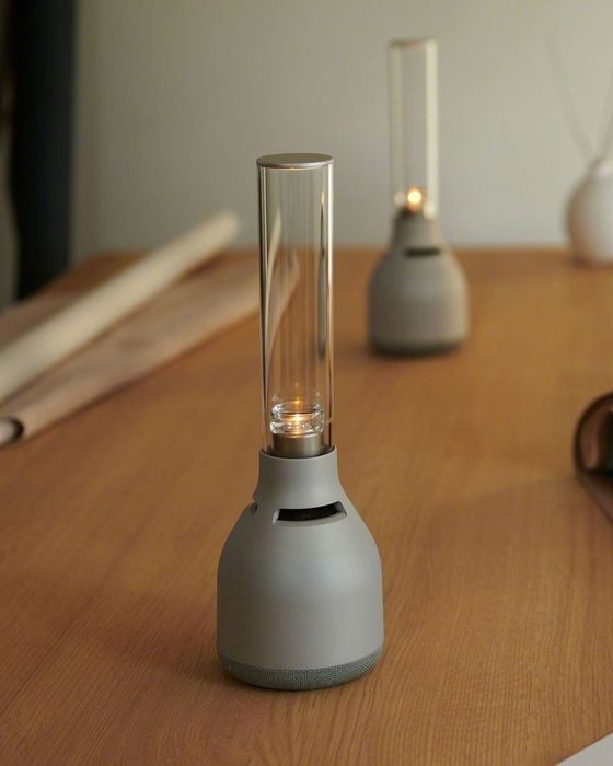 The glass speaker featuring a ceramic base.