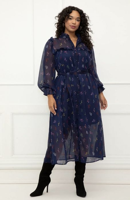 A model wearing the navy dress