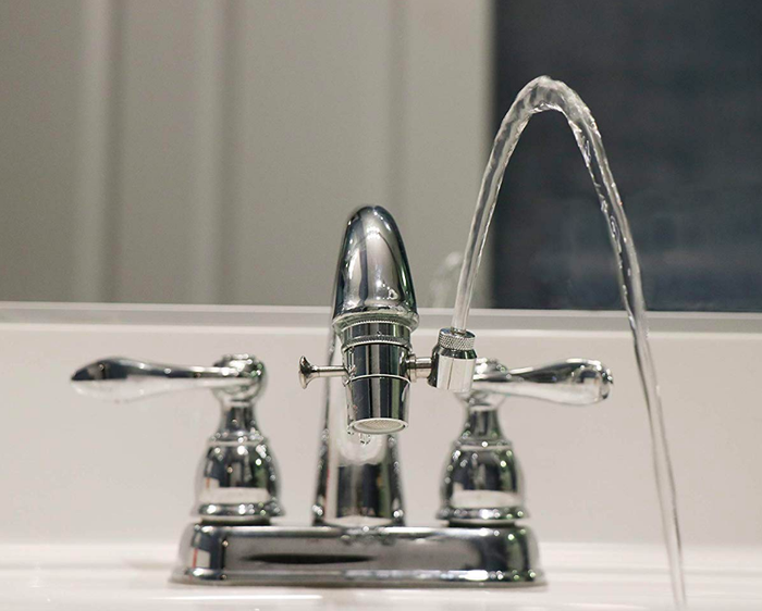 A sink spout that creates an arc of water for drinking