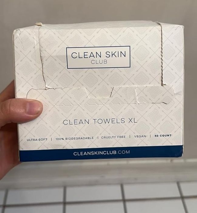 Reviewer holding the box of towels