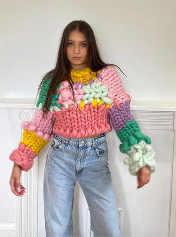 A model is sporting the colossal chunky knit jumper.