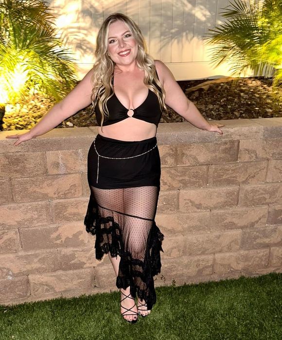 A reviewer wearing the black top.