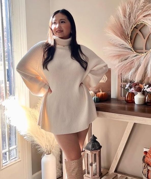 A reviewer styling the apricot sweater.